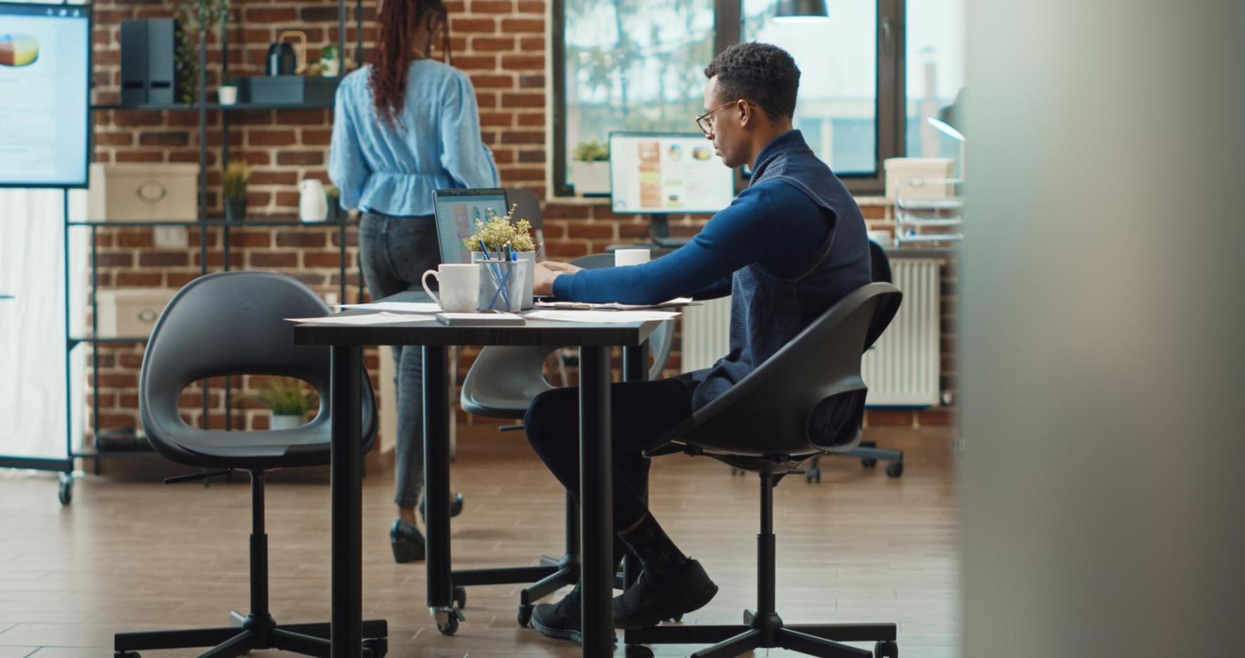 Professional trading desk setup showing multiple monitors with international market data and risk management tools